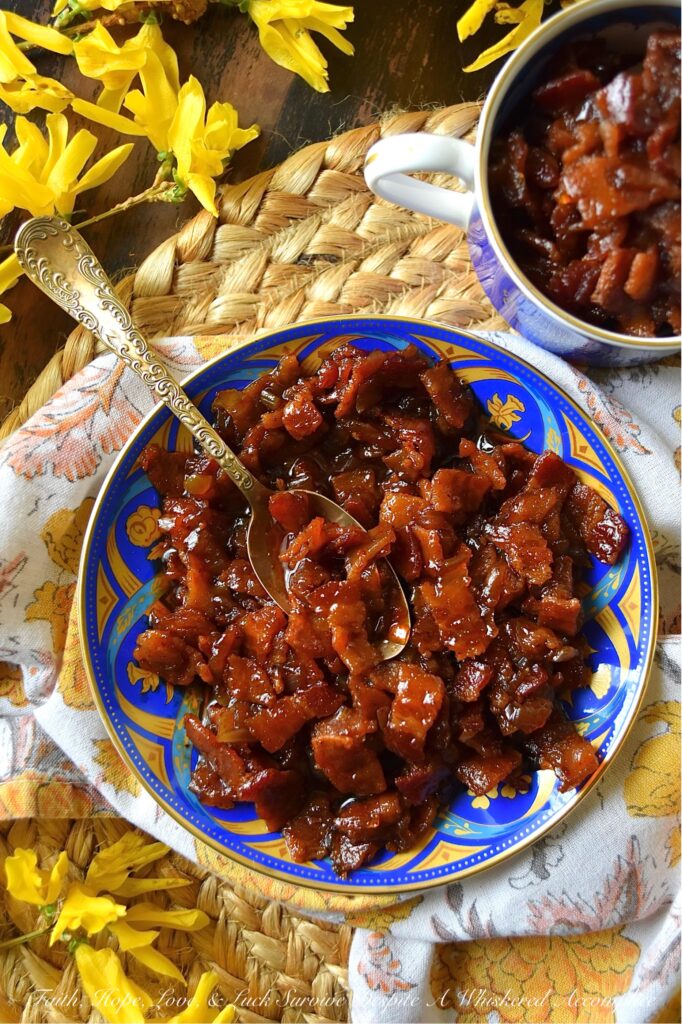 Bourbon & Onion Bacon Jam - This mouthwatering condiment combines the rich saltiness of bacon with the sweetness of yellow onions, smoky chili powder, and a touch of maple syrup and brown sugar. A splash of apple cider vinegar and a hint of bourbon also add a delightful tang and boozy kick to this delectable bacon jam. Whether used as a sandwich spread, mixed with cream cheese for a cracker topping, or even as a unique addition to deviled eggs, this irresistible Bourbon & Onion Bacon jam is guaranteed to have you coming back for more.
