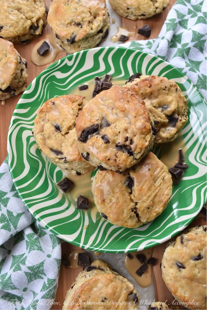 Dark Chocolate Chunk Baileys Cream Scones - These scones are the ultimate treat for any Baileys enthusiast. Bursting with rich, creamy Baileys Irish Cream flavor and studded with indulgent chunks of dark chocolate, these scones are perfect for a special breakfast, tea time, or dessert treat. They have a crumbly texture, a luscious and boozy Baileys glaze, and just the right hint of sweetness to satisfy all of your cravings.