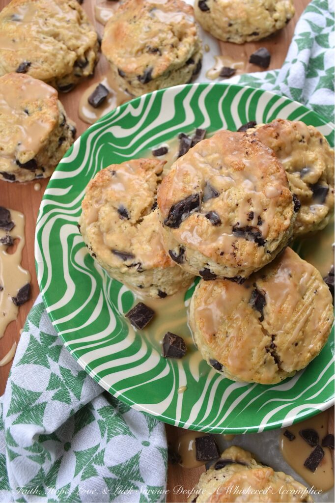Dark Chocolate Chunk Baileys Cream Scones - These scones are the ultimate treat for any Baileys enthusiast. Bursting with rich, creamy Baileys Irish Cream flavor and studded with indulgent chunks of dark chocolate, these scones are perfect for a special breakfast, tea time, or dessert treat. They have a crumbly texture, a luscious and boozy Baileys glaze, and just the right hint of sweetness to satisfy all of your cravings.