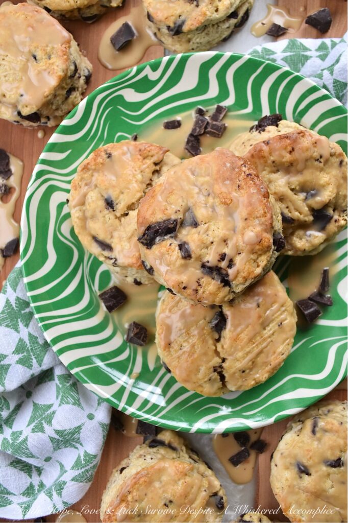 Dark Chocolate Chunk Baileys Cream Scones - These scones are the ultimate treat for any Baileys enthusiast. Bursting with rich, creamy Baileys Irish Cream flavor and studded with indulgent chunks of dark chocolate, these scones are perfect for a special breakfast, tea time, or dessert treat. They have a crumbly texture, a luscious and boozy Baileys glaze, and just the right hint of sweetness to satisfy all of your cravings.