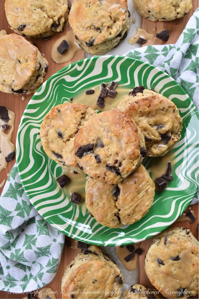Dark Chocolate Chunk Baileys Cream Scones - These scones are the ultimate treat for any Baileys enthusiast. Bursting with rich, creamy Baileys Irish Cream flavor and studded with indulgent chunks of dark chocolate, these scones are perfect for a special breakfast, tea time, or dessert treat. They have a crumbly texture, a luscious and boozy Baileys glaze, and just the right hint of sweetness to satisfy all of your cravings.