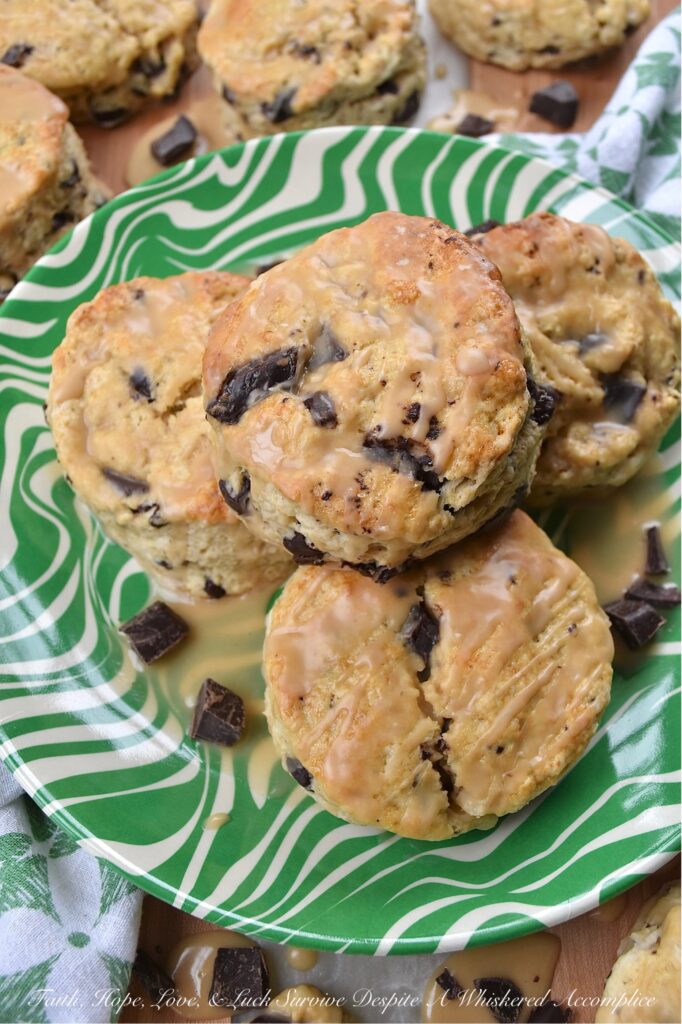 Dark Chocolate Chunk Baileys Cream Scones - These scones are the ultimate treat for any Baileys enthusiast. Bursting with rich, creamy Baileys Irish Cream flavor and studded with indulgent chunks of dark chocolate, these scones are perfect for a special breakfast, tea time, or dessert treat. They have a crumbly texture, a luscious and boozy Baileys glaze, and just the right hint of sweetness to satisfy all of your cravings.