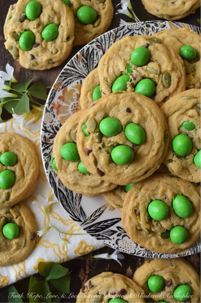 Lucky St. Patrick's Day M&M Cookies with Pepitas - St. Patrick's Day is just around the corner, and what better way to celebrate than with these Lucky St. Patrick's Day M&M Cookies with Pepitas? These chewy and crunchy cookies are a delightful combination of green Milk Chocolate M&M's, miniature semi-sweet chocolate chips, and nutty roasted salted pepitas. Topped with green Peanut M&M's for an extra pop of color and crunch, these festive and delicious cookies are sure to be a hit at any St. Patrick's Day gathering and are the perfect way to spread some lucky holiday cheer.