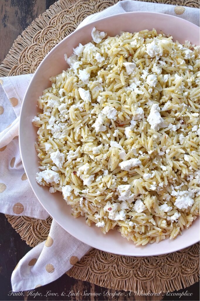 Orange & Feta Italian Orzo Pasta Salad - This simple orzo pasta salad is the perfect side dish to complement almost any meal. It's quick and easy to make, is neither too dry nor too oily, and has a bright orange citrusy flavor that pairs so well with its flavorful Italian dressing. A generous amount of feta cheese is the final touch to making this pasta salad incredibly delicious and irresistible.