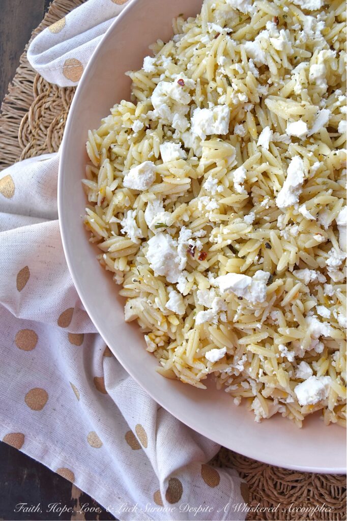 Orange & Feta Italian Orzo Pasta Salad - This simple orzo pasta salad is the perfect side dish to complement almost any meal. It's quick and easy to make, is neither too dry nor too oily, and has a bright orange citrusy flavor that pairs so well with its flavorful Italian dressing. A generous amount of feta cheese is the final touch to making this pasta salad incredibly delicious and irresistible.