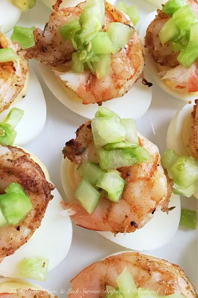 Jerk Shrimp & Sweet Green Tomato Deviled Eggs - Summer is the perfect time to experiment with new flavors and ingredients, and what better way to do that than with a twist on a classic appetizer? These jerk-seasoned deviled eggs are not only a little bit spicy, but they also have a delightful sweet green tomato tanginess that will leave your taste buds dancing. Packed with a delightful Caribbean flavor, these deviled eggs are sure to be a hit at your next summer gathering.