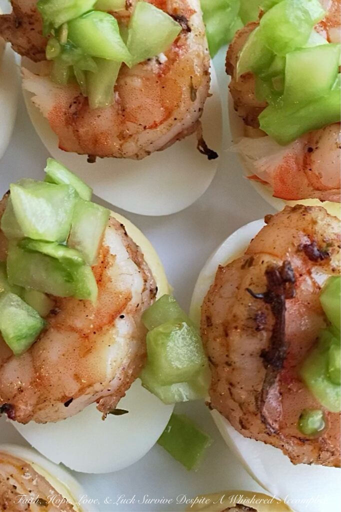 Jerk Shrimp & Sweet Green Tomato Deviled Eggs - Summer is the perfect time to experiment with new flavors and ingredients, and what better way to do that than with a twist on a classic appetizer? These jerk-seasoned deviled eggs are not only a little bit spicy, but they also have a delightful sweet green tomato tanginess that will leave your taste buds dancing. Packed with a delightful Caribbean flavor, these deviled eggs are sure to be a hit at your next summer gathering.