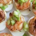 Jerk Shrimp & Sweet Green Tomato Deviled Eggs - Summer is the perfect time to experiment with new flavors and ingredients, and what better way to do that than with a twist on a classic appetizer? These jerk-seasoned deviled eggs are not only a little bit spicy, but they also have a delightful sweet green tomato tanginess that will leave your taste buds dancing. Packed with a delightful Caribbean flavor, these deviled eggs are sure to be a hit at your next summer gathering.