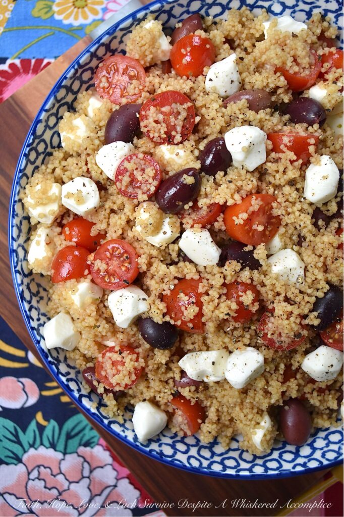 Kalamata, Mozzarella, & Tomato Couscous Salad - Looking for an easy and satisfying pasta side dish? Try this fluffy wheat couscous salad with tangy Kalamata olives, juicy cherry or grape tomatoes, and creamy fresh mozzarella pearls. With minimal time and effort, you can create a substantial pasta salad that is perfect for any occasion. Plus, it's easy to stretch out to serve larger crowds by simply adding fresh vegetables or Italian deli meat to the mix.