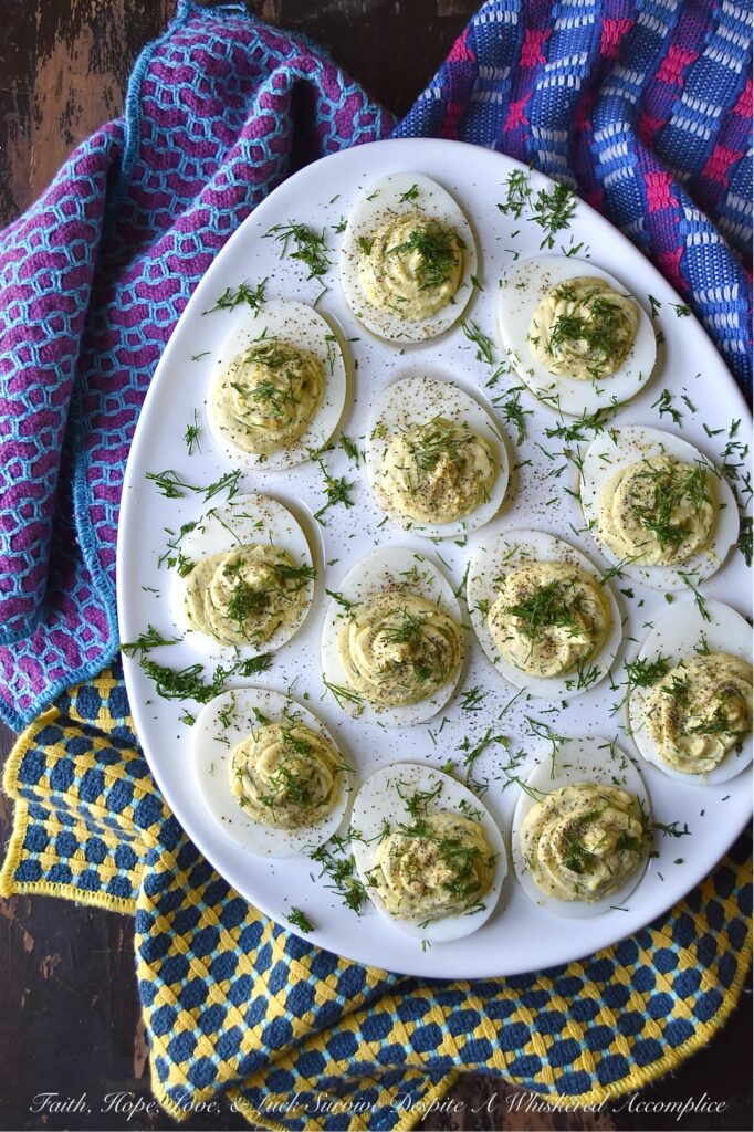 Fresh Dill Deviled Eggs with a Hint of Lemon - This easy-to-make recipe delivers a sophisticated twist on a familiar favorite, perfect for any gathering, from casual potlucks to elegant dinners. This recipe takes the classic deviled egg and elevates it with the bright, earthy flavor of fresh dill along with the subtle hint of citrusy lemon zest and tart lemon juice. Whether you're hosting an elegant brunch, a casual gathering, or simply seeking an extraordinary appetizer to elevate your next meal, these deviled eggs are destined to become a crowd-pleaser.