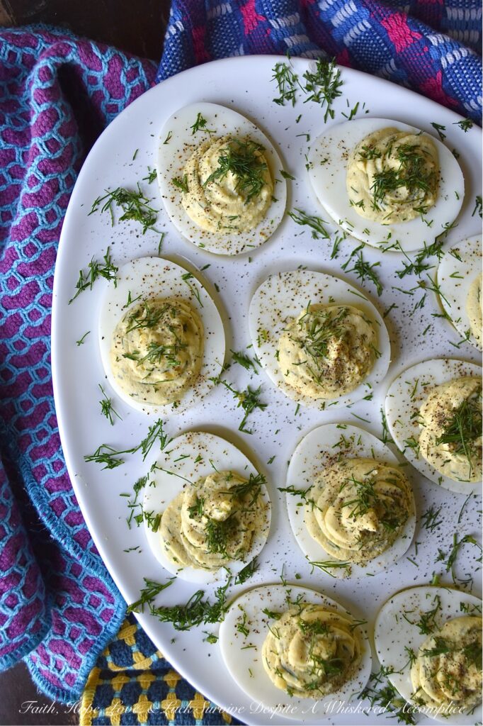 Fresh Dill Deviled Eggs with a Hint of Lemon - This easy-to-make recipe delivers a sophisticated twist on a familiar favorite, perfect for any gathering, from casual potlucks to elegant dinners. This recipe takes the classic deviled egg and elevates it with the bright, earthy flavor of fresh dill along with the subtle hint of citrusy lemon zest and tart lemon juice. Whether you're hosting an elegant brunch, a casual gathering, or simply seeking an extraordinary appetizer to elevate your next meal, these deviled eggs are destined to become a crowd-pleaser.