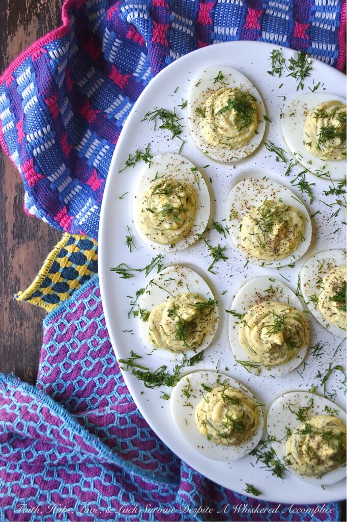 Fresh Dill Deviled Eggs with a Hint of Lemon - This easy-to-make recipe delivers a sophisticated twist on a familiar favorite, perfect for any gathering, from casual potlucks to elegant dinners. This recipe takes the classic deviled egg and elevates it with the bright, earthy flavor of fresh dill along with the subtle hint of citrusy lemon zest and tart lemon juice. Whether you're hosting an elegant brunch, a casual gathering, or simply seeking an extraordinary appetizer to elevate your next meal, these deviled eggs are destined to become a crowd-pleaser.