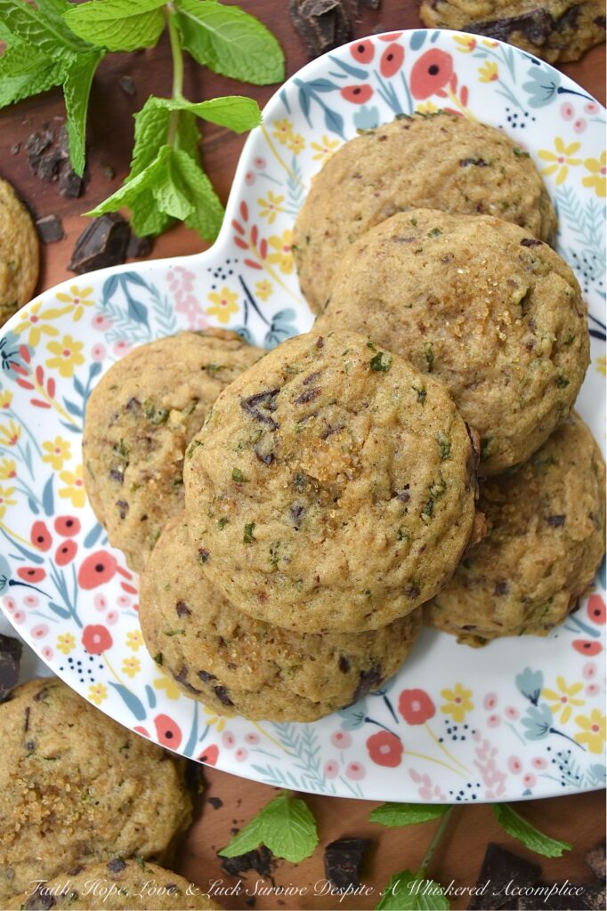 Chocolate Chunk Cookies with Fresh Mint - Imagine soft, chewy brown sugar cookies, bursting with the refreshing taste of fresh mint. Now, add in just the right amount of roughly chopped rich chocolate chunks. These chocolate chunk cookies with fresh mint are the epitome of summer's sweet indulgence, offering a cool and minty twist on the classic brown sugar cookie. If your backyard garden or porch planters are overflowing with fresh mint, or you just so happen to stumble upon gorgeous fresh mint at your local market or grocery store, these cookies are a must-bake.