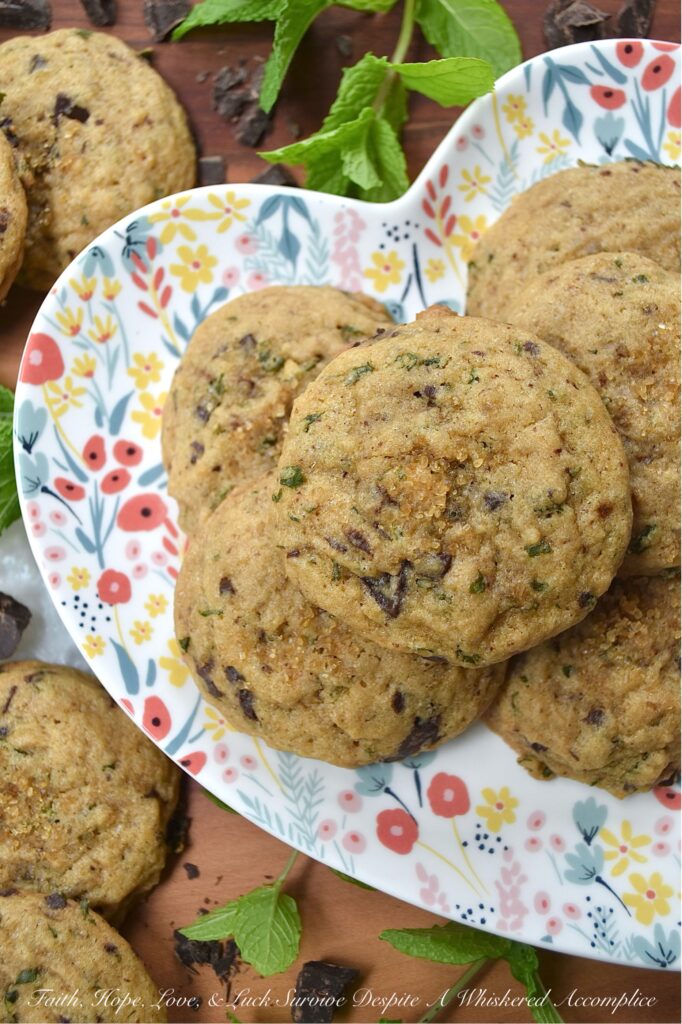 Chocolate Chunk Cookies with Fresh Mint - Imagine soft, chewy brown sugar cookies, bursting with the refreshing taste of fresh mint. Now, add in just the right amount of roughly chopped rich chocolate chunks. These chocolate chunk cookies with fresh mint are the epitome of summer's sweet indulgence, offering a cool and minty twist on the classic brown sugar cookie. If your backyard garden or porch planters are overflowing with fresh mint, or you just so happen to stumble upon gorgeous fresh mint at your local market or grocery store, these cookies are a must-bake.