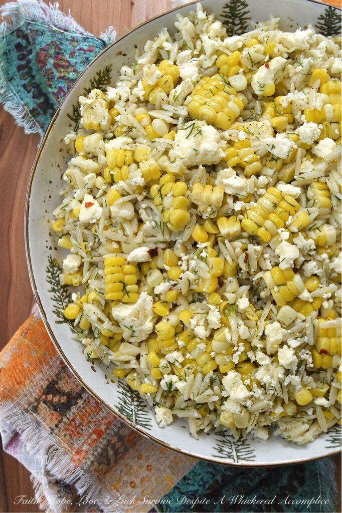 Orzo Pasta Salad with Fresh Dill, Corn, and Feta - This easy-to-make orzo pasta salad brings together the sweet, juicy kernels of summer corn, the fragrant flavor of fresh dill, and the tangy, salty goodness of crumbled feta cheese. Its dressing, which is a simple blend of lemon zest and juice, olive oil, honey, and a touch of seasoning, really allows the fresh corn and dill to shine in this simple, yet satisfying summer pasta salad.