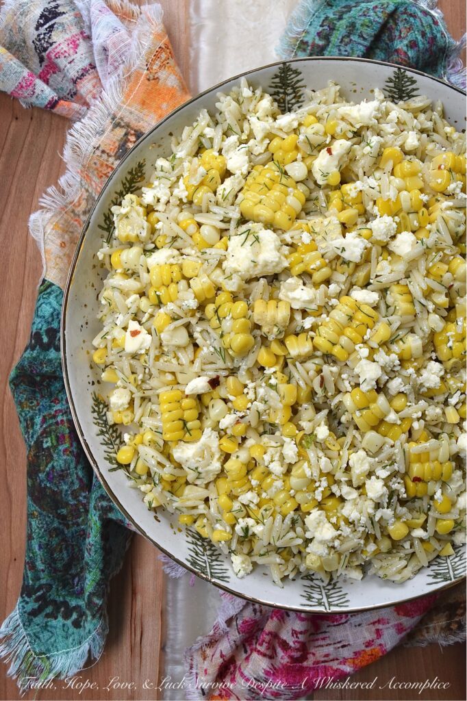 Orzo Pasta Salad with Fresh Dill, Corn, and Feta - This easy-to-make orzo pasta salad brings together the sweet, juicy kernels of summer corn, the fragrant flavor of fresh dill, and the tangy, salty goodness of crumbled feta cheese. Its dressing, which is a simple blend of lemon zest and juice, olive oil, honey, and a touch of seasoning, really allows the fresh corn and dill to shine in this simple, yet satisfying summer pasta salad.