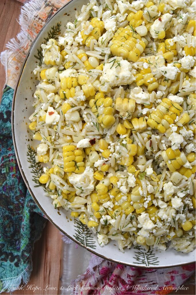 Orzo Pasta Salad with Fresh Dill, Corn, and Feta - This easy-to-make orzo pasta salad brings together the sweet, juicy kernels of summer corn, the fragrant flavor of fresh dill, and the tangy, salty goodness of crumbled feta cheese. Its dressing, which is a simple blend of lemon zest and juice, olive oil, honey, and a touch of seasoning, really allows the fresh corn and dill to shine in this simple, yet satisfying summer pasta salad.