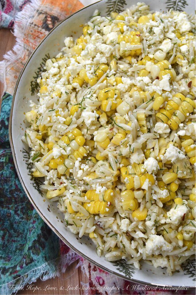 Orzo Pasta Salad with Fresh Dill, Corn, and Feta - This easy-to-make orzo pasta salad brings together the sweet, juicy kernels of summer corn, the fragrant flavor of fresh dill, and the tangy, salty goodness of crumbled feta cheese. Its dressing, which is a simple blend of lemon zest and juice, olive oil, honey, and a touch of seasoning, really allows the fresh corn and dill to shine in this simple, yet satisfying summer pasta salad.