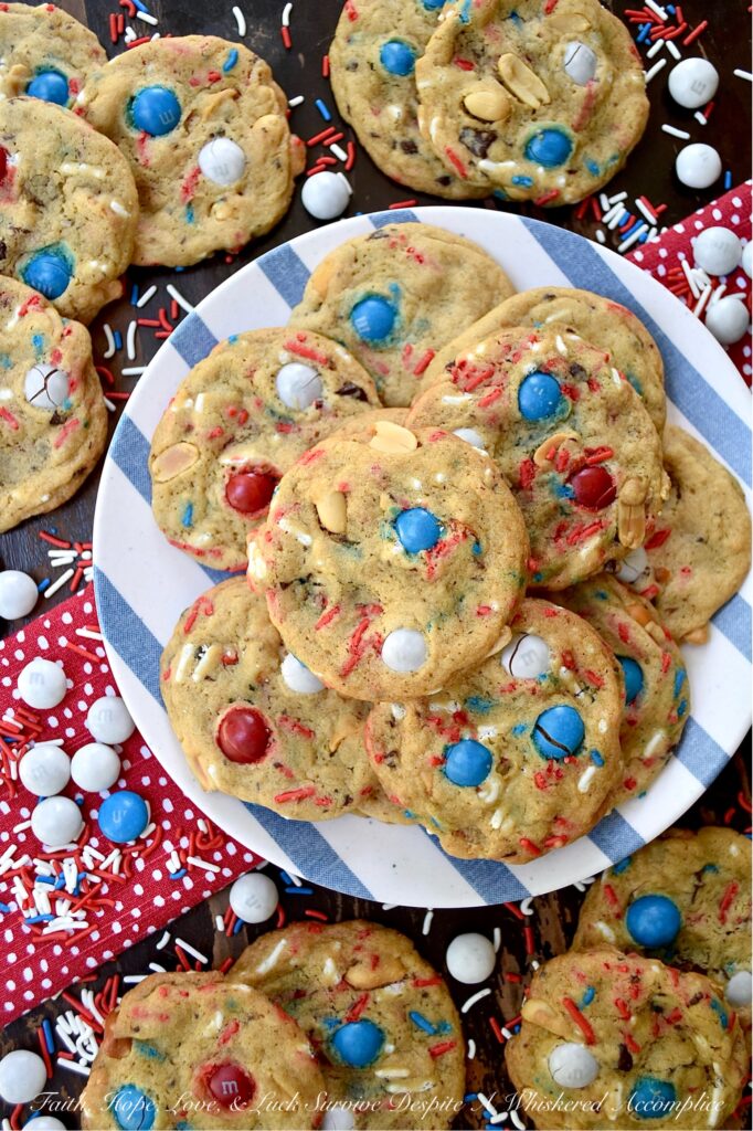 Summertime Cookies with Peanut Butter M&M's - Picture this, a soft and chewy brown sugar cookie, infused with the irresistible crunch of chunky salted cocktail peanuts and the colorful sweet burst of Peanut Butter M&M's. But wait, there's more. These cookies are just as colorful, festive, and enticing as they are delicious. With the addition of colorful summertime sprinkles, these attractively irresistible cookies are destined to become a real crowd-pleaser, whether served at your next barbecue, picnic, or summer vacation pool party.