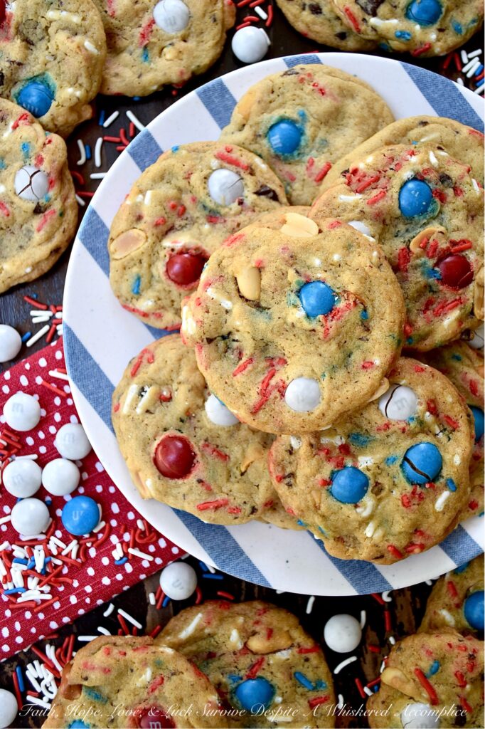 Summertime Cookies with Peanut Butter M&M's - Picture this, a soft and chewy brown sugar cookie, infused with the irresistible crunch of chunky salted cocktail peanuts and the colorful sweet burst of Peanut Butter M&M's. But wait, there's more. These cookies are just as colorful, festive, and enticing as they are delicious. With the addition of colorful summertime sprinkles, these attractively irresistible cookies are destined to become a real crowd-pleaser, whether served at your next barbecue, picnic, or summer vacation pool party.
