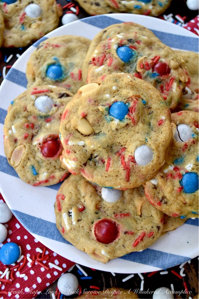 Summertime Cookies with Peanut Butter M&M's - Picture this, a soft and chewy brown sugar cookie, infused with the irresistible crunch of chunky salted cocktail peanuts and the colorful sweet burst of Peanut Butter M&M's. But wait, there's more. These cookies are just as colorful, festive, and enticing as they are delicious. With the addition of colorful summertime sprinkles, these attractively irresistible cookies are destined to become a real crowd-pleaser, whether served at your next barbecue, picnic, or summer vacation pool party.