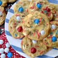 Summertime Cookies with Peanut Butter M&M's - Picture this, a soft and chewy brown sugar cookie, infused with the irresistible crunch of chunky salted cocktail peanuts and the colorful sweet burst of Peanut Butter M&M's. But wait, there's more. These cookies are just as colorful, festive, and enticing as they are delicious. With the addition of colorful summertime sprinkles, these attractively irresistible cookies are destined to become a real crowd-pleaser, whether served at your next barbecue, picnic, or summer vacation pool party.