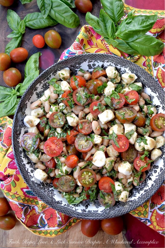Great Northern Bean Summer Caprese Salad - Caprese salad, with its seasonal ingredients, vibrant colors, and refreshing flavors, is a classic summertime staple. This easy-to-assemble great northern bean salad is made with fresh basil, sun-ripened tomatoes, and creamy fresh mozzarella pearls. For a twist on the traditional recipe, try this no-cook bean salad that combines canned great northern beans with classic Caprese salad ingredients. Not only does this flavorful side dish complement most summer meals, but it also helps keep your kitchen cool during the hot and humid months of summer.