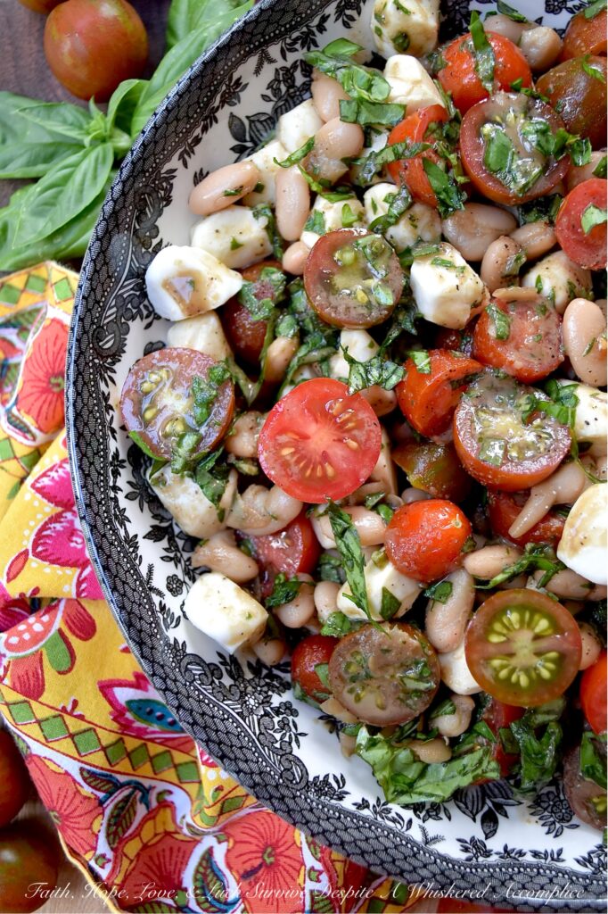 Great Northern Bean Summer Caprese Salad - Caprese salad, with its seasonal ingredients, vibrant colors, and refreshing flavors, is a classic summertime staple. This easy-to-assemble great northern bean salad is made with fresh basil, sun-ripened tomatoes, and creamy fresh mozzarella pearls. For a twist on the traditional recipe, try this no-cook bean salad that combines canned great northern beans with classic Caprese salad ingredients. Not only does this flavorful side dish complement most summer meals, but it also helps keep your kitchen cool during the hot and humid months of summer.