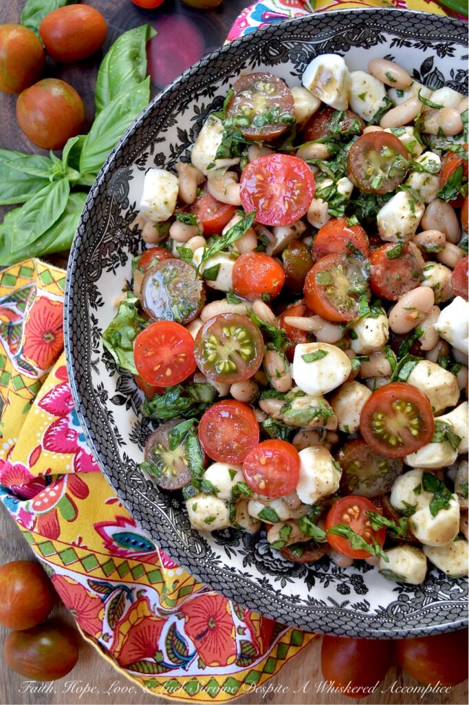 Great Northern Bean Summer Caprese Salad - Caprese salad, with its seasonal ingredients, vibrant colors, and refreshing flavors, is a classic summertime staple. This easy-to-assemble great northern bean salad is made with fresh basil, sun-ripened tomatoes, and creamy fresh mozzarella pearls. For a twist on the traditional recipe, try this no-cook bean salad that combines canned great northern beans with classic Caprese salad ingredients. Not only does this flavorful side dish complement most summer meals, but it also helps keep your kitchen cool during the hot and humid months of summer.