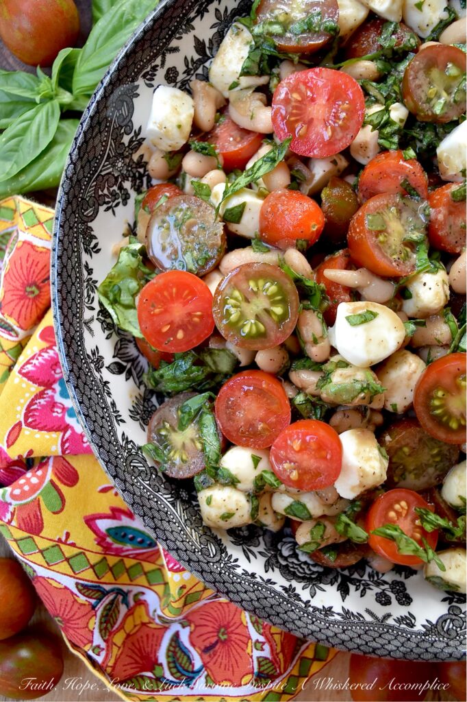 Great Northern Bean Summer Caprese Salad - Caprese salad, with its seasonal ingredients, vibrant colors, and refreshing flavors, is a classic summertime staple. This easy-to-assemble great northern bean salad is made with fresh basil, sun-ripened tomatoes, and creamy fresh mozzarella pearls. For a twist on the traditional recipe, try this no-cook bean salad that combines canned great northern beans with classic Caprese salad ingredients. Not only does this flavorful side dish complement most summer meals, but it also helps keep your kitchen cool during the hot and humid months of summer.