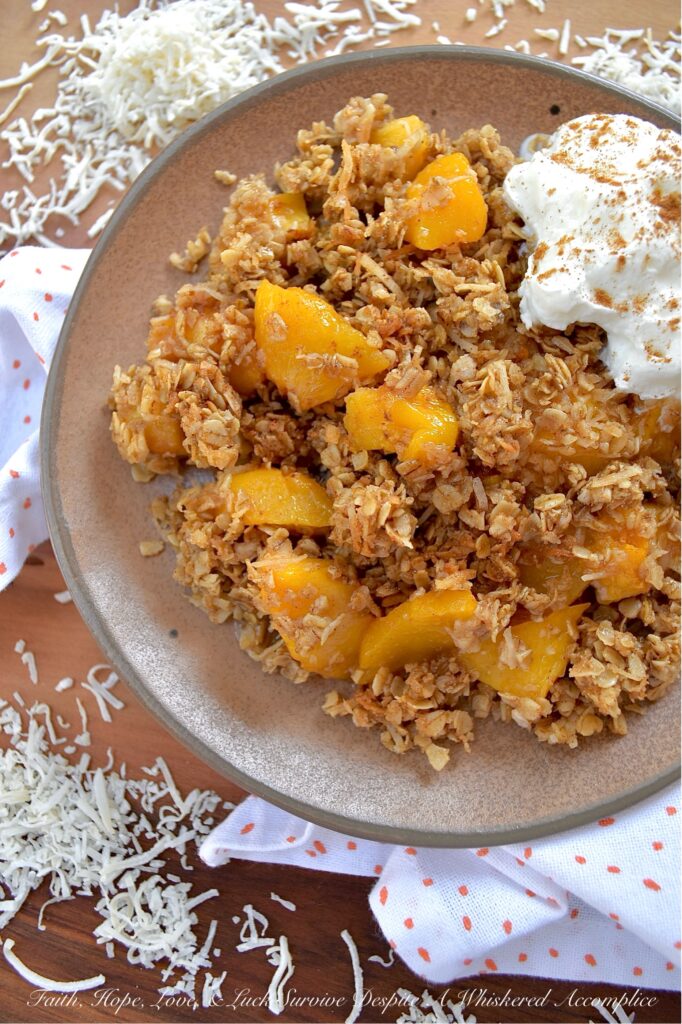 Unsweetened Coconut Oatmeal Peach Crisp - You just can't beat a warm, comforting, bubbly oatmeal peach crisp fresh out of the oven, especially if it's topped with a crunchy buttery topping made with quick-cooking oats, unsweetened shredded coconut, brown sugar, cinnamon, melted butter, and vanilla. And, since you can use either fresh or frozen peaches for this fruity dessert, this is one simple and easy recipe that you'll be able to enjoy year-round.