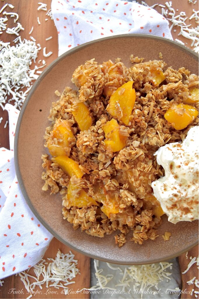 Unsweetened Coconut Oatmeal Peach Crisp - You just can't beat a warm, comforting, bubbly oatmeal peach crisp fresh out of the oven, especially if it's topped with a crunchy buttery topping made with quick-cooking oats, unsweetened shredded coconut, brown sugar, cinnamon, melted butter, and vanilla. And, since you can use either fresh or frozen peaches for this fruity dessert, this is one simple and easy recipe that you'll be able to enjoy year-round.