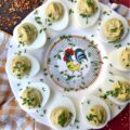 Sweet & Spicy Balsamic Vinegar Deviled Eggs - This recipe elevates traditional deviled eggs by incorporating tangy balsamic vinegar, a touch of sugar, and a kick from crushed red pepper flakes, creating a sweet and spicy appetizer that's sure to be an instant crowd-pleaser. Freshly chopped chives not only add a vibrant burst of color but also provide a refreshing onion flavor that perfectly complements the rich, creamy, sweet, and spicy balsamic vinegar deviled egg filling.