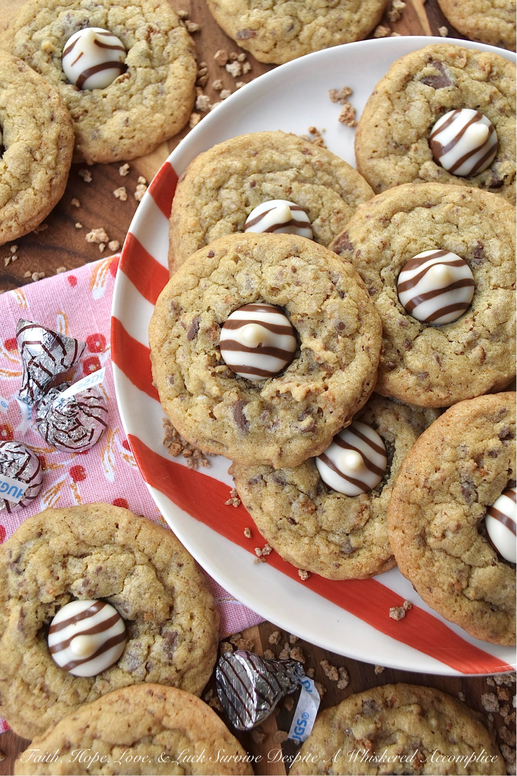 X's & O's (Hugs & Kisses) Brown Sugar Cookies - Nothing quite compares to the warmth of a hug or the sweetness of a kiss, and with these X's & O's Brown Sugar Cookies, you won't have to choose between the two. These cookies are topped with Hershey's Hugs and infused with the rich, melty goodness of roughly chopped Milk Chocolate Hershey’s Kisses. The unexpected addition of Grape Nuts cereal gives these buttery, crunchy, and chocolatey hugs and kisses cookies a delightful twist that makes them almost impossible not to fall head over heels in love with.