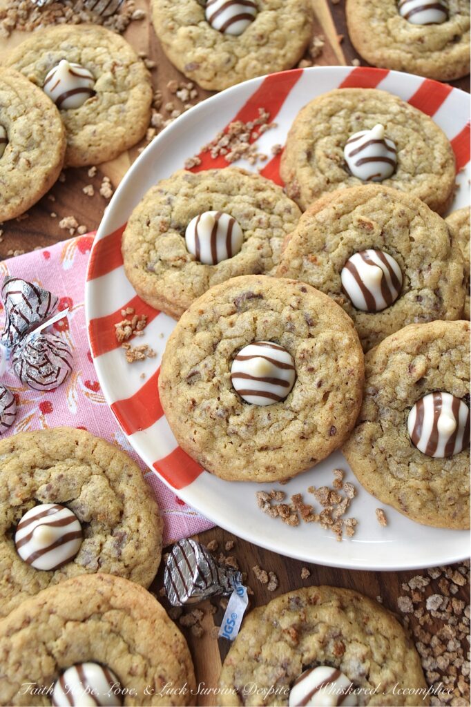 X's & O's (Hugs & Kisses) Brown Sugar Cookies - Nothing quite compares to the warmth of a hug or the sweetness of a kiss, and with these X's & O's Brown Sugar Cookies, you won't have to choose between the two. These cookies are topped with Hershey's Hugs and infused with the rich, melty goodness of roughly chopped Milk Chocolate Hershey’s Kisses. The unexpected addition of Grape Nuts cereal gives these buttery, crunchy, and chocolatey hugs and kisses cookies a delightful twist that makes them almost impossible not to fall head over heels in love with.
