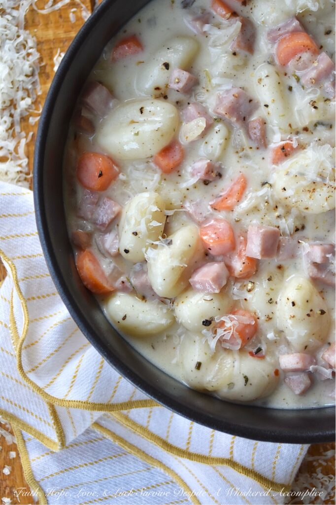 One-Pot Italian Ham Soup with Potato Gnocchi - Sometimes the last thing you have time for is an elaborate dinner. Life gets busy, and the thought of spending hours in the kitchen can be just exhausting. This Italian-seasoned soup recipe proves that you don't need fancy, elaborate ingredients or hours of cooking to create a flavorful, deeply satisfying meal. This one-pot soup combination of store-bought pillowy potato gnocchi, savory diced ham steak, and aromatic herbs all simmered together, delivers a convenient, delicious, and satisfying meal, perfect for those nights when you need a little bit of simple comfort food, fast.