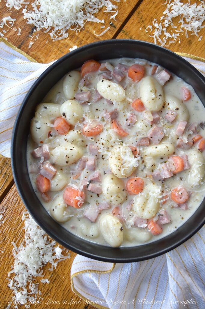 One-Pot Italian Ham Soup with Potato Gnocchi - Sometimes the last thing you have time for is an elaborate dinner. Life gets busy, and the thought of spending hours in the kitchen can be just exhausting. This Italian-seasoned soup recipe proves that you don't need fancy, elaborate ingredients or hours of cooking to create a flavorful, deeply satisfying meal. This one-pot soup combination of store-bought pillowy potato gnocchi, savory diced ham steak, and aromatic herbs all simmered together, delivers a convenient, delicious, and satisfying meal, perfect for those nights when you need a little bit of simple comfort food, fast.