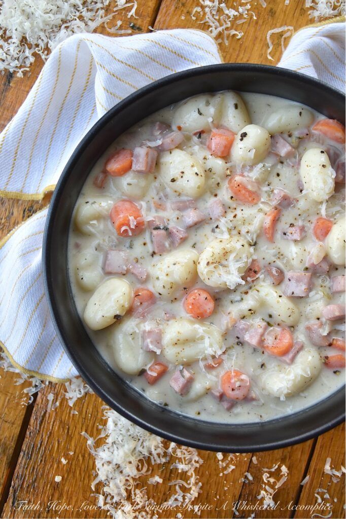 One-Pot Italian Ham Soup with Potato Gnocchi - Sometimes the last thing you have time for is an elaborate dinner. Life gets busy, and the thought of spending hours in the kitchen can be just exhausting. This Italian-seasoned soup recipe proves that you don't need fancy, elaborate ingredients or hours of cooking to create a flavorful, deeply satisfying meal. This one-pot soup combination of store-bought pillowy potato gnocchi, savory diced ham steak, and aromatic herbs all simmered together, delivers a convenient, delicious, and satisfying meal, perfect for those nights when you need a little bit of simple comfort food, fast.
