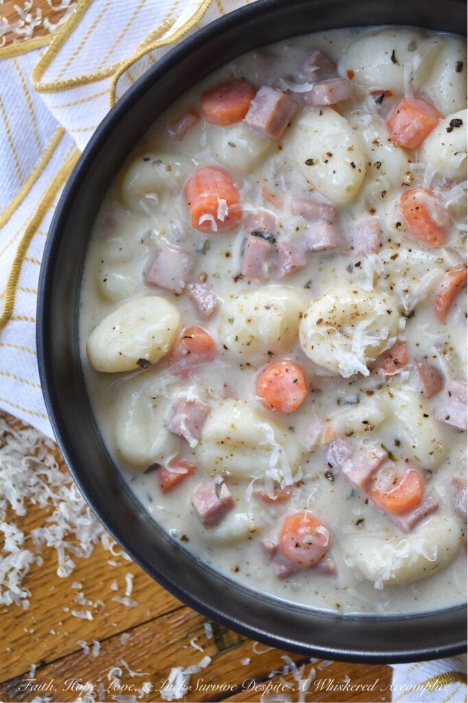 One-Pot Italian Ham Soup with Potato Gnocchi - Sometimes the last thing you have time for is an elaborate dinner. Life gets busy, and the thought of spending hours in the kitchen can be just exhausting. This Italian-seasoned soup recipe proves that you don't need fancy, elaborate ingredients or hours of cooking to create a flavorful, deeply satisfying meal. This one-pot soup combination of store-bought pillowy potato gnocchi, savory diced ham steak, and aromatic herbs all simmered together, delivers a convenient, delicious, and satisfying meal, perfect for those nights when you need a little bit of simple comfort food, fast.