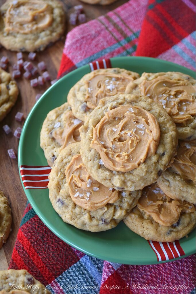 Peanut Butter Frosted Jammy Bits Cookies - These simple brown sugar cookies are no ordinary treat; they’re packed with wholesome quick-cooking oats and bursting with the tangy sweet goodness of soft, chewy raspberry jammy bits. Topped with a luscious easy-to-make peanut butter frosting and a touch of flaky sea salt, these peanut butter-frosted brown sugar cookies are the perfect indulgence for any occasion. Be prepared to make a double batch because everyone will be asking for seconds.