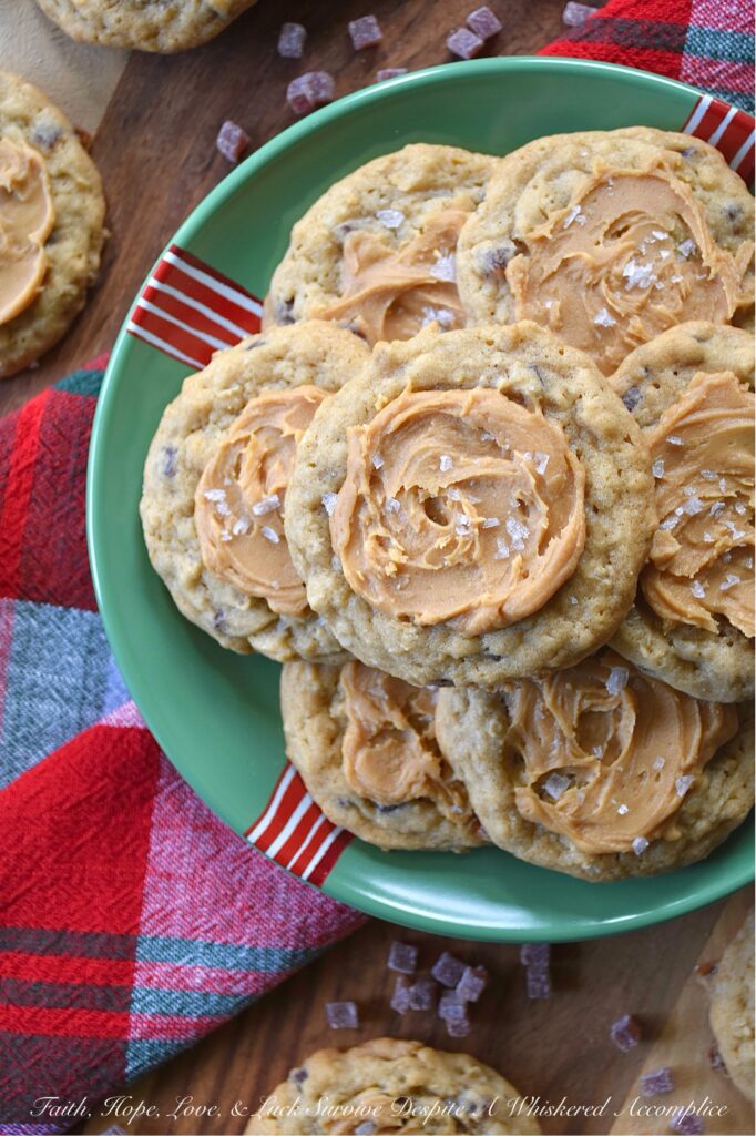 Peanut Butter Frosted Jammy Bits Cookies - These simple brown sugar cookies are no ordinary treat; they’re packed with wholesome quick-cooking oats and bursting with the tangy sweet goodness of soft, chewy raspberry jammy bits. Topped with a luscious easy-to-make peanut butter frosting and a touch of flaky sea salt, these peanut butter-frosted brown sugar cookies are the perfect indulgence for any occasion. Be prepared to make a double batch because everyone will be asking for seconds.