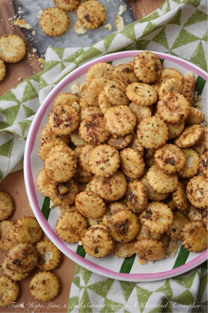 Zesty Italian Balsamic Baked Oyster Crackers - Whether you're hosting a lively game night, attending a festive holiday gathering, or simply snuggling up for a movie marathon, these savory oyster crackers are sure to be a hit. Easy to prepare and irresistibly addictive, they are the ultimate indulgence for those seeking a zesty balsamic vinegar and flavorful Italian seasoning salty snack. Baked to perfection, these zesty oyster crackers offer a savory crunch that pairs beautifully with soup or chili, making them an excellent addition to almost any meal as well.