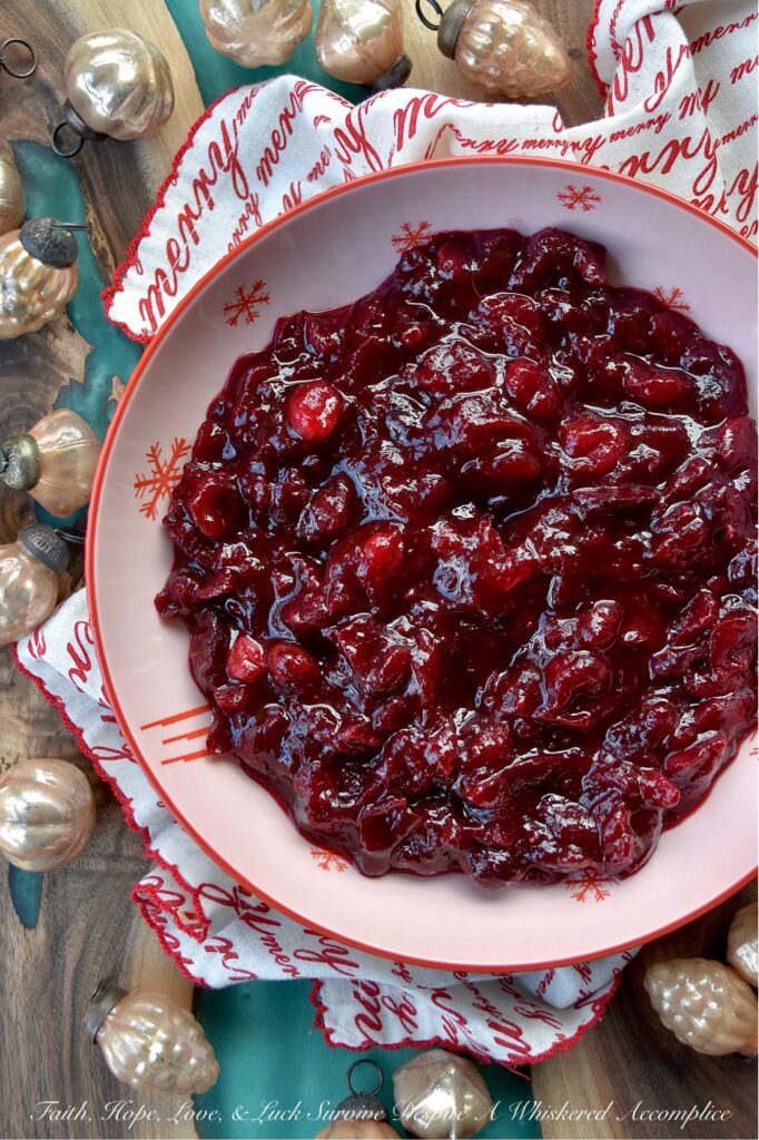 Cherry & Brandy Whole Berry Cranberry Sauce - Get ready to impress your holiday guests this season with this delightful sweet and tart cherry-flavored cranberry sauce. Made with frozen cherries, brandy, and a lovely mix of granulated and light brown sugars, this fresh cranberry side dish is sure to impress. With just a dash of cinnamon, a pinch of sea salt, and a hint of vanilla, it’s bursting with flavor. Best of all, this colorful cranberry sauce is super easy to make, leaving you more time to spend with your family and friends this holiday season.