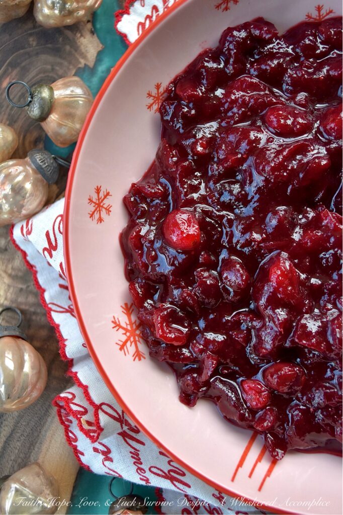 Cherry & Brandy Whole Berry Cranberry Sauce - Get ready to impress your holiday guests this season with this delightful sweet and tart cherry-flavored cranberry sauce. Made with frozen cherries, brandy, and a lovely mix of granulated and light brown sugars, this fresh cranberry side dish is sure to impress. With just a dash of cinnamon, a pinch of sea salt, and a hint of vanilla, it’s bursting with flavor. Best of all, this colorful cranberry sauce is super easy to make, leaving you more time to spend with your family and friends this holiday season.