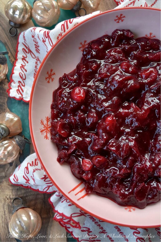 Cherry & Brandy Whole Berry Cranberry Sauce - Get ready to impress your holiday guests this season with this delightful sweet and tart cherry-flavored cranberry sauce. Made with frozen cherries, brandy, and a lovely mix of granulated and light brown sugars, this fresh cranberry side dish is sure to impress. With just a dash of cinnamon, a pinch of sea salt, and a hint of vanilla, it’s bursting with flavor. Best of all, this colorful cranberry sauce is super easy to make, leaving you more time to spend with your family and friends this holiday season.
