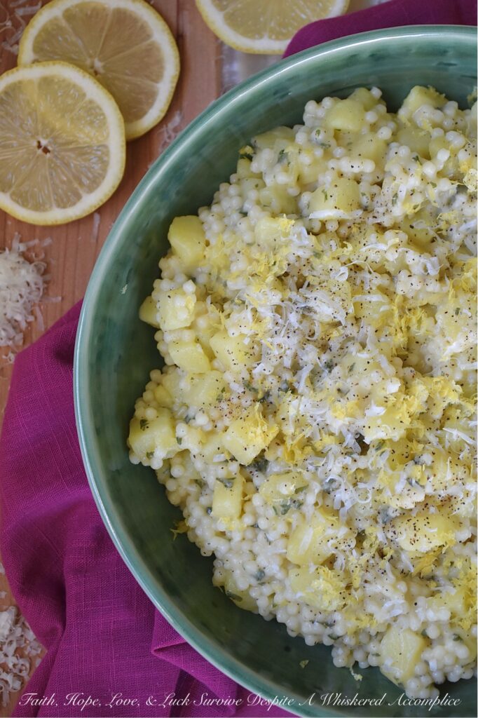 Creamy Parmesan Acini di Pepe with Potatoes - Why choose between pasta and potatoes, when you can have both in one comforting recipe? Tender, small-cubed Yukon gold potatoes, and delicate Acini di Pepe pasta are tossed in a silky, light, shiny sauce made with grated Parmesan, pasta water, and a touch of butter. The result is an easy-to-make, healthier alternative to macaroni and cheese or mashed potatoes, infused with a peppery warmth and a bright, zesty kiss of lemon.