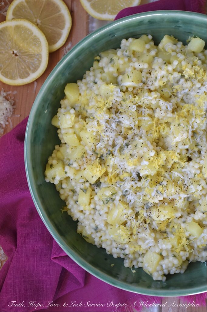 Creamy Parmesan Acini di Pepe with Potatoes - Why choose between pasta and potatoes, when you can have both in one comforting recipe? Tender, small-cubed Yukon gold potatoes, and delicate Acini di Pepe pasta are tossed in a silky, light, shiny sauce made with grated Parmesan, pasta water, and a touch of butter. The result is an easy-to-make, healthier alternative to macaroni and cheese or mashed potatoes, infused with a peppery warmth and a bright, zesty kiss of lemon.
