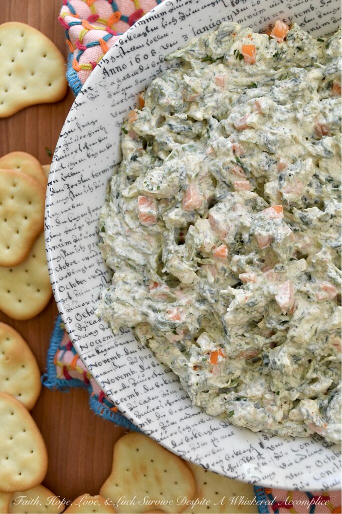 Classic Homemade Spinach Dip (No Soup Mix) - What makes this classic spinach dip truly special is its delicious homemade blend of herbs and seasonings. By skipping the packet of store-bought soup mix, you get a fresh and vibrant taste that pre-packaged versions simply can’t compete with. The result is a creamy, flavorful dip that's perfect for pairing with your favorite crackers, chips, or pretzels. This quick and easy homemade spinach dip is sure to be a hit at your next gathering.