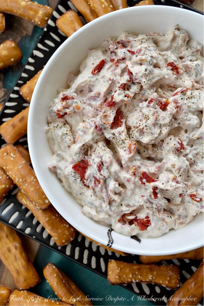 Sun-Dried Tomato Dip with Italian Seasoning - Looking for a quick, easy, and incredibly delicious dip that's perfect for any occasion? This sun-dried tomato dip with Italian seasoning is the perfect crowd-pleaser for any occasion with its creamy combination of tangy sour cream and sweet mayonnaise. Finely chopped sun-dried tomatoes add a delightful burst of texture and intense, sun-kissed tomato flavor. Whether you're hosting a party, cheering on your favorite team, or just enjoying a family game night, this Italian-seasoned dip is guaranteed to be an instant hit.