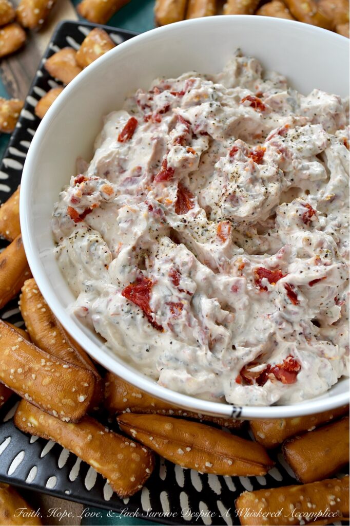 Sun-Dried Tomato Dip with Italian Seasoning - Looking for a quick, easy, and incredibly delicious dip that's perfect for any occasion? This sun-dried tomato dip with Italian seasoning is the perfect crowd-pleaser for any occasion with its creamy combination of tangy sour cream and sweet mayonnaise. Finely chopped sun-dried tomatoes add a delightful burst of texture and intense, sun-kissed tomato flavor. Whether you're hosting a party, cheering on your favorite team, or just enjoying a family game night, this Italian-seasoned dip is guaranteed to be an instant hit.